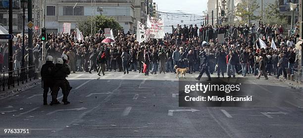 Police clash with misile throwing protesters on March 11, 2010 in Athens, Greece. A 24-hour general strike is being held to protest against the...