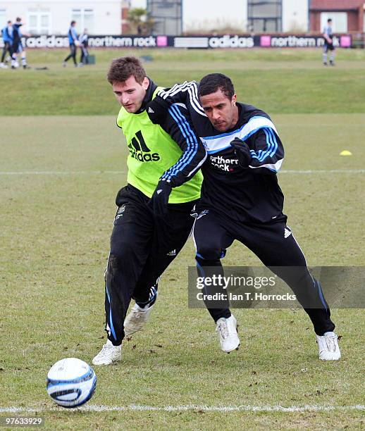 Wayne Routledge of Newcastle tangles with Tamas Kadar during a Newcastle United training session at the Little Benton training ground on March 11,...