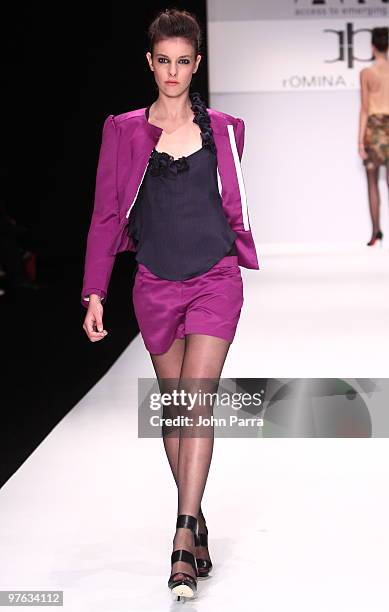 Model walks the runway at the Romina Heighes show during the Gen Art 6th Annual Fresh Faces in Fashion Show during the opening of FASHIONmiami at...