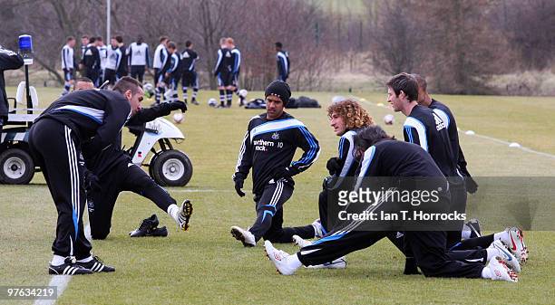 Wayne Routledge of Newcastle stretches during a Newcastle United training session at the Little Benton training ground on March 11, 2010 in Newcastle...
