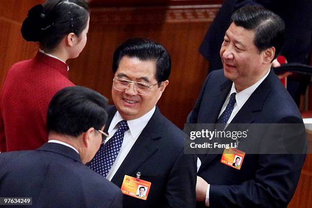 China's President Hu Jintao and Vice President Xi Jinping leave after the fourth plenary session of the National People's Congress at The Great Hall...