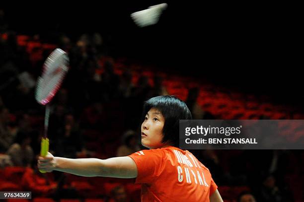 China's Jiang Yanjiao return's a shot to Indonesia' Maria Febe Kusumastuti during their women's singles second round match at the Badminton All...