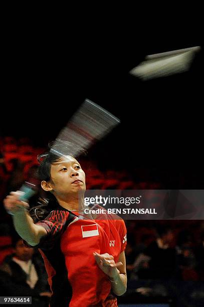 Indonesia's Maria Febe Kusumastuti returns a shot to China's Jiang Yanjiao during their women's singles second round match at the Badminton All...