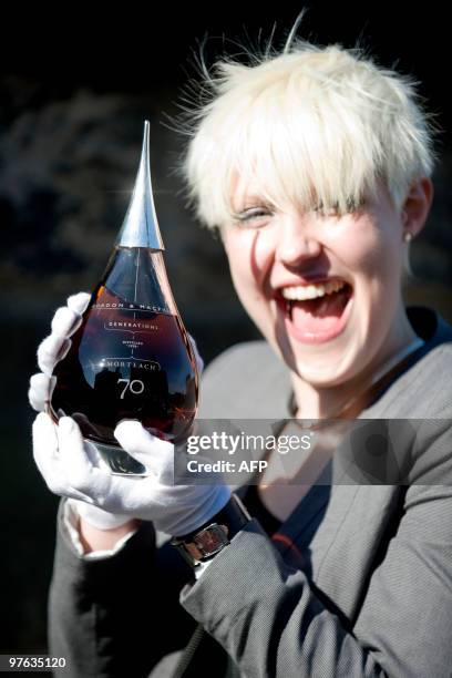 Claire Urquhart holds a bottle of what is believed to be the world�s oldest bottled single malt whisky as it is launched at Edinburgh Castle, in...