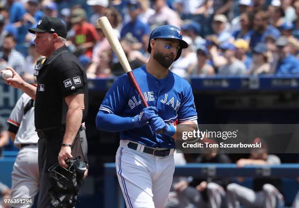 Kevin Pillar of the Toronto Blue Jays reacts after being called out on strikes by home plate umpire Ted Barrett in the first inning during MLB game...