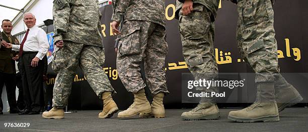 Defence Secretary Robert Gates speaks with US troops on March 11, 2010 during a visit to an undisclosed military base in south west Asia. Gates...