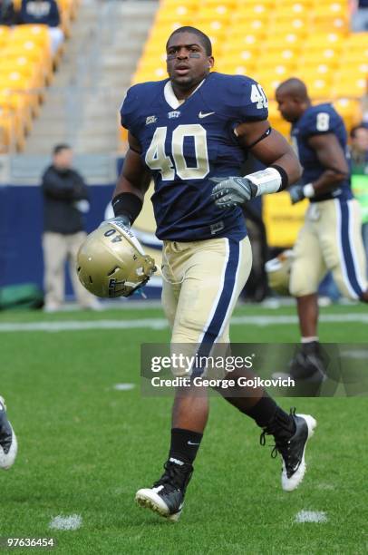 Linebacker Dan Mason of the University of Pittsburgh Panthers runs on the field before a college football game against the University of Connecticut...
