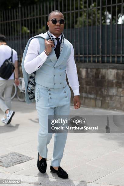 Guest is seen during the 94th Pitti Immagine Uomo wearing a baby blue suit with vest and white shirt on June 14, 2018 in Florence, Italy.