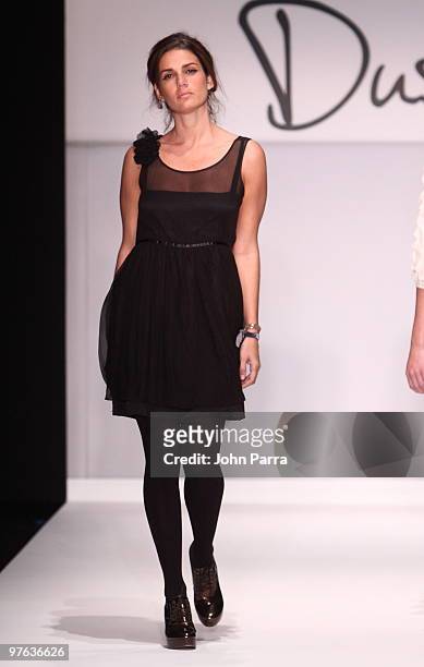 Model walks the runway at the Duskin show during the Gen Art 6th Annual Fresh Faces in Fashion Show during the opening of FASHIONmiami at Miami...