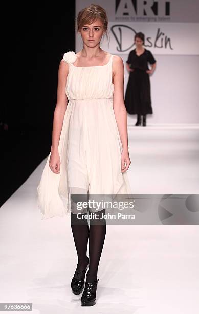 Model walks the runway at the Duskin show during the Gen Art 6th Annual Fresh Faces in Fashion Show during the opening of FASHIONmiami at Miami...