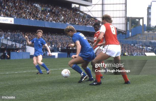 Kerry Dixon of Chelsea runs with the ball watched by team-mate Micky Hazard during the Canon League Division One match between Chelsea and Arsenal...