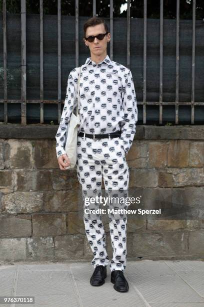 Guest is seen during the 94th Pitti Immagine Uomo wearing a graphic print pattern outfit with black shoes on June 14, 2018 in Florence, Italy.