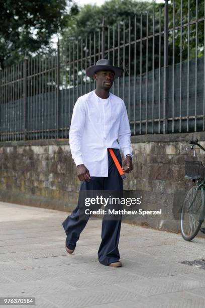Salomon DuBois Thiombiano is seen during the 94th Pitti Immagine Uomo wearing COS with Goorin Bros. Hat on June 14, 2018 in Florence, Italy.