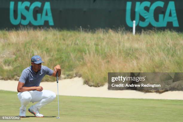 Tony Finau of the United States lines up a putt on the 16th green during the third round of the 2018 U.S. Open at Shinnecock Hills Golf Club on June...