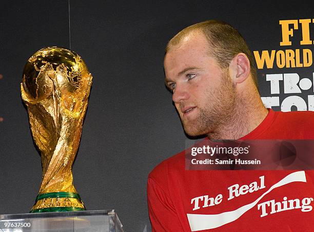 Wayne Rooney poses with the authentic FIFA World Cup Trophy as part of the FIFA World Cup Trophy Tour on March 11, 2010 at Earls Court in London,...