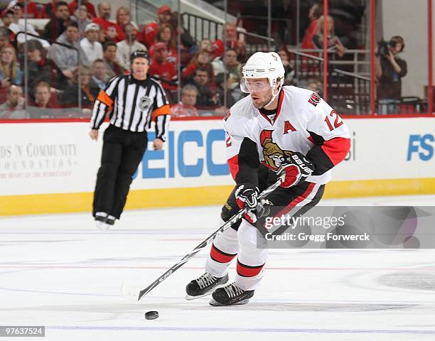 Mike Fisher of the Ottawa Senators skates with the puck during a NHL game against the Carolina Hurricanes on March 4, 2010 at RBC Center in Raleigh,...