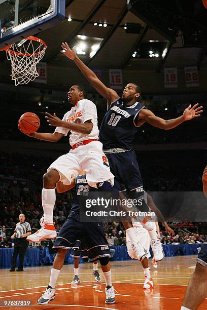 Kris Joseph of the Syracuse Orange goes to the hoop against Greg Monroe of the Georgetown Hoyas during the quarterfinal of the 2010 NCAA Big East...