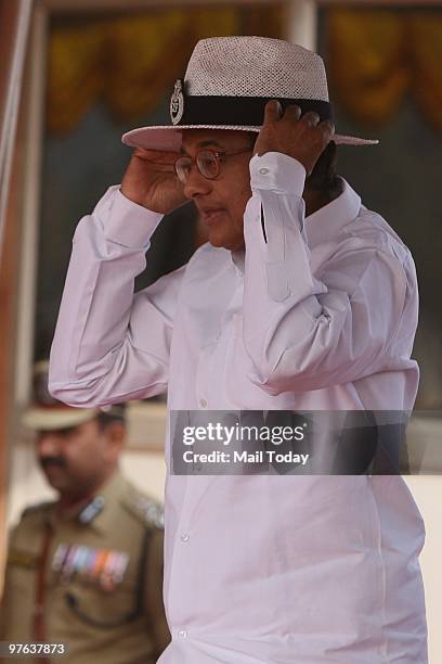 Union Home Minister P Chidambaram wears a CISF hat at the 41st raising day parade of the CISF in New Delhi on March 10, 2010.