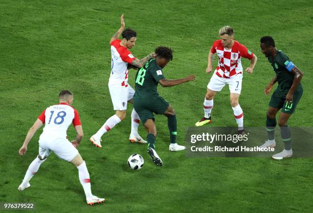 Alex Iwobi of Nigeria is stopped by Sime Vrsaljko and Ante Rebic under the eyes Ivan Rakitic of Croatia and John Obi Mikel of Nigeria during the 2018...