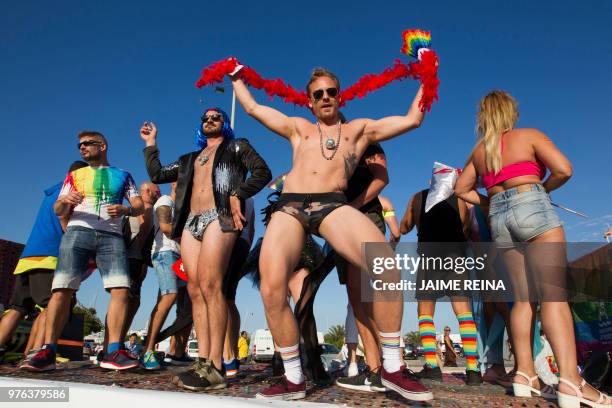 Revelers take part in the Ibiza Gay Pride Parade on June 16, 2018 in Ibiza Town.