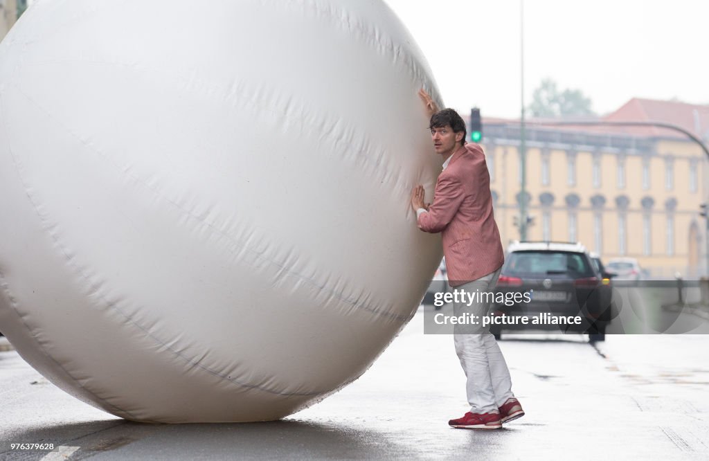 Artist rolls large, inflatable ball through Osnabrueck
