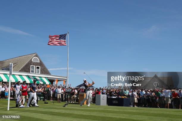 Dustin Johnson of the United States plays his shot from the first tee during the third round of the 2018 U.S. Open at Shinnecock Hills Golf Club on...
