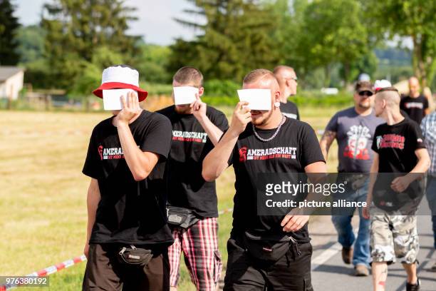June 2018, Germany, Themar: Festivalgoers on their way to the festival site for the "Tage der nationalen Bewegung" festival. The 2-day festival...