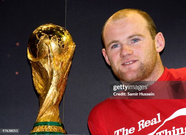 Wayne Rooney poses with the authentic FIFA World Cup Trophy as part of the FIFA World Cup Trophy Tour on March 11, 2010 at Earls Court in London,...