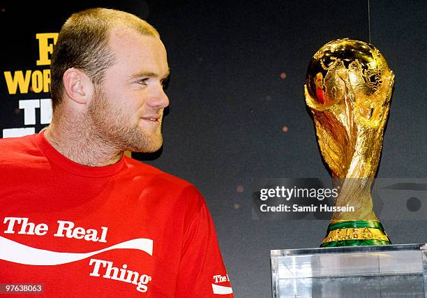 Wayne Rooney poses with the authentic FIFA World Cup Trophy as part of the FIFA World Cup Trophy Tour on March 11, 2010 at Earls Court in London,...
