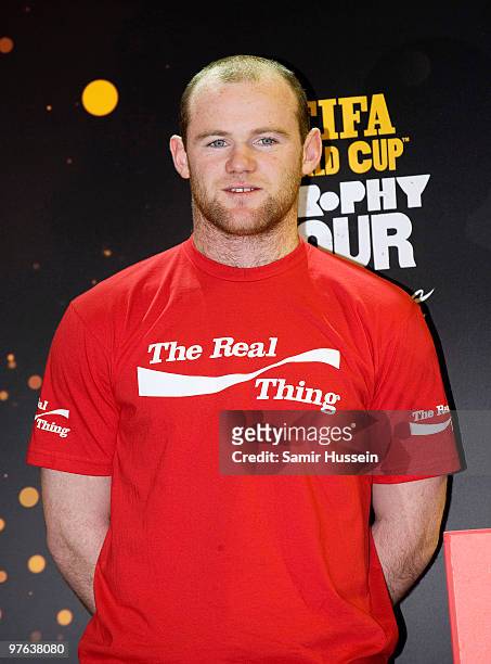 Wayne Rooney looks on after posing with the authentic FIFA World Cup Trophy as part of the FIFA World Cup Trophy Tour on March 11, 2010 at Earls...