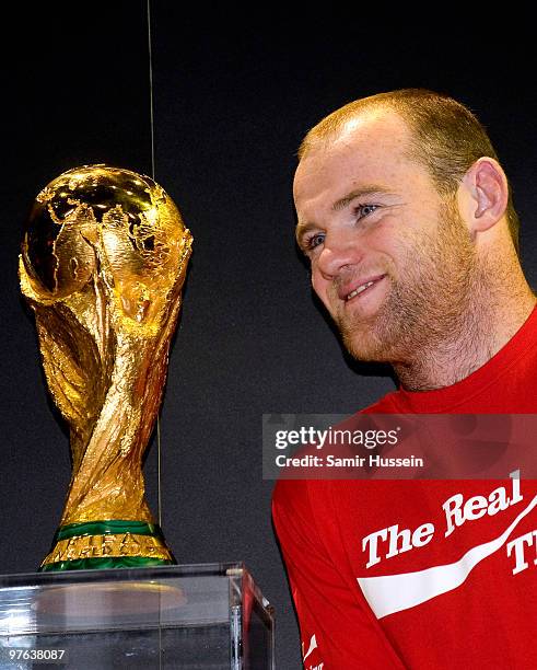 Wayne Rooney poses with the authentic FIFA World Cup Trophy as part of the FIFA World Cup Trophy Tour on March 11, 2010 at Earls Court in London,...