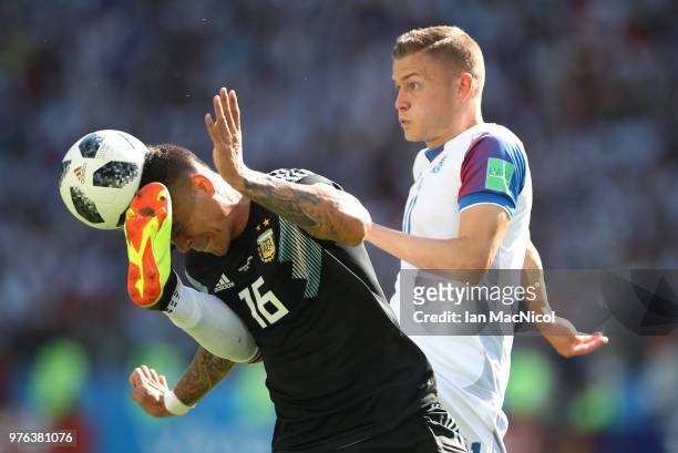 Marcos Rojo of Argentina vies with Alfred Finnbogason of Iceland during the 2018 FIFA World Cup Russia group D match between Argentina and Iceland at...