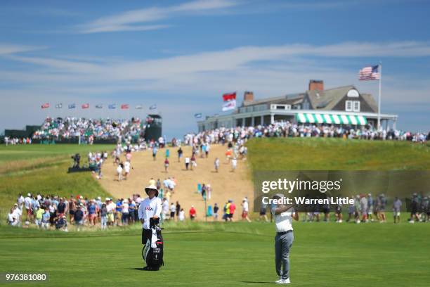 Russell Henley of the United States plays his second shot on the first green during the third round of the 2018 U.S. Open at Shinnecock Hills Golf...