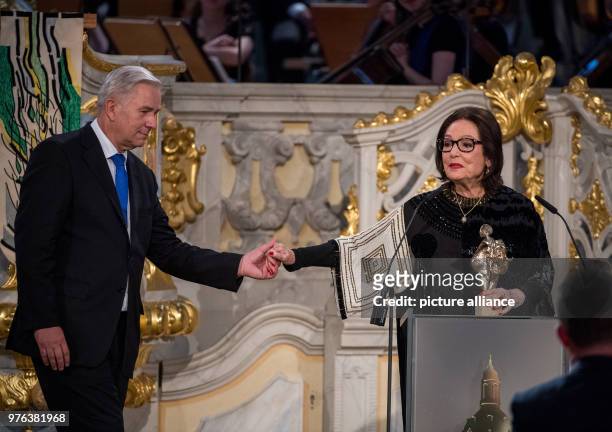 June 2018, Germany, Dresden: Award winner Nana Mouskouri, a singer from Greece, and speaker Klaus Wowereit, former mayor of Berlin, stand on stage at...