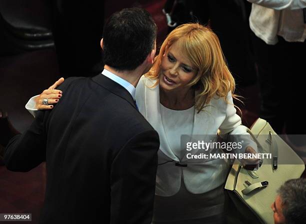 Spanish Crown Prince Felipe de Borbon kisses Chilean Cecilia Bolocco, wife of former Argentina´s President Carlos Saul Menem, during the presidential...