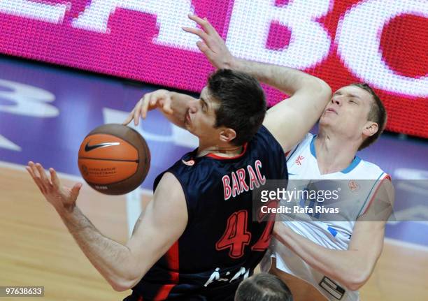 Leon Radosevic, #10 of KK Cibona Zagreb competes with Stanko Barac, #42 of Caja Laboral during the Euroleague Basketball 2009-2010 Last 16 Game 6...