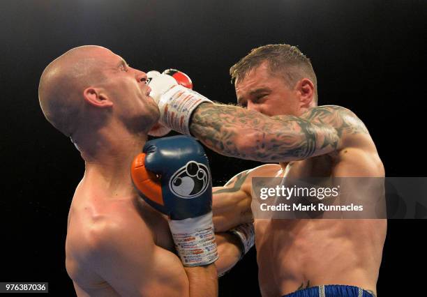 Ricky Burns , takes on Ivan Njegac red white and blue shorts), during the Super-Lightweight contest presented by Matchroom Boxing at Metro Radio...