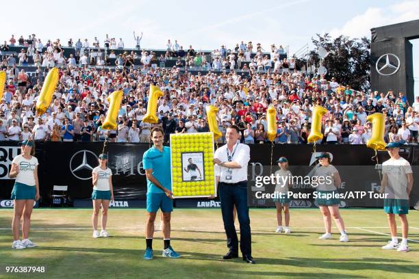 Roger Federer of Switzerland and Tournament Director Edwin Weindorfer with a presentation for regaining the world number one title after his...