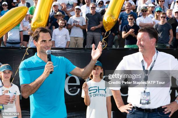 Roger Federer of Switzerland and Tournament Director Edwin Weindorfer with a presentation for regaining the world number one title after his...