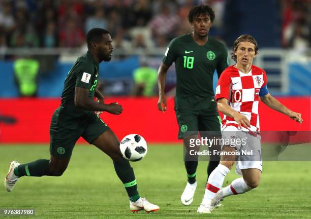 Bryan Idowu of Nigeria runs with the ball under pressure from Luka Modric of Croatia during the 2018 FIFA World Cup Russia group D match between...