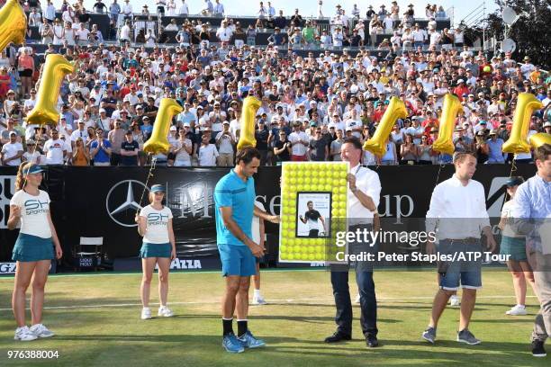 Roger Federer of Switzerland and Tournament Director Edwin Weindorfer with a presentation for regaining the world number one title after his...