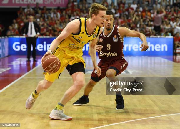 Marius Grigonis of Alba Berlin and Jared Cunningham of FC Bayern Munich during the game between FC Bayern Munich and Alba Berlin on june 16, 2018 in...