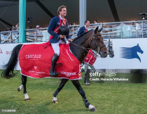 Darragh Kenny and Gregory Wathelet of winning team Paris Panthers perform a victory lap at the end of "CSI 5" GCL of Cascais Estoril Round 2 -...