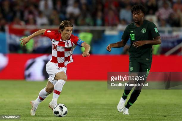 Luka Modric of Croatia is challenged by Alex Iwobi of Nigeria during the 2018 FIFA World Cup Russia group D match between Croatia and Nigeria at...
