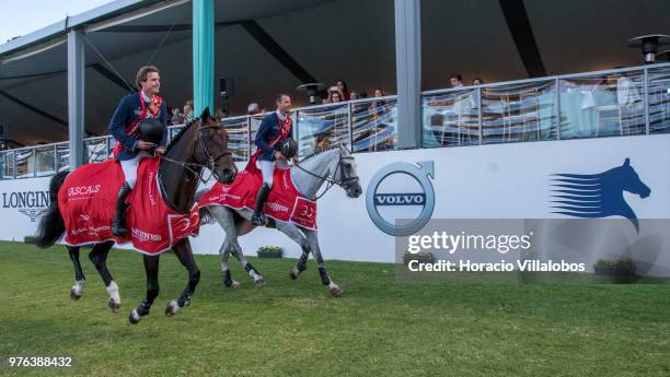 Darragh Kenny and Gregory Wathelet of winning team Paris Panthers perform a victory lap at the end of "CSI 5" GCL of Cascais Estoril Round 2 -...