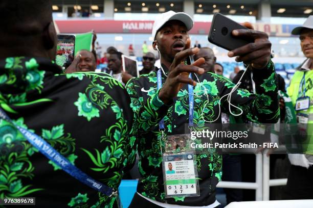 Kelechi Iheanacho of Nigeria uses his phone during a pitch inspection prior to the 2018 FIFA World Cup Russia group D match between Croatia and...