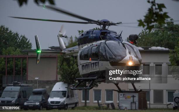 June 2018, Germany, Wiesbaden: A police helicopter with Ali B. On board, the suspect in the Susanna case, lands with officers from a special police...