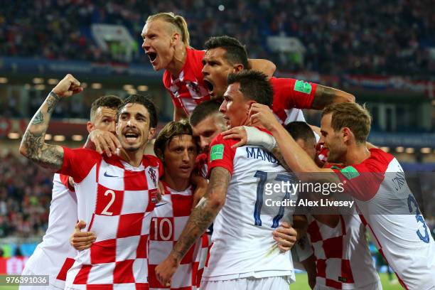 Luka Modric of Croatia celebrates with teammates after scoring his team's second goal during the 2018 FIFA World Cup Russia group match between...