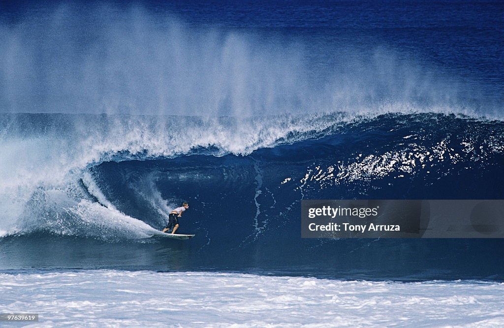 Surfer riding a wave , Oahu , Hawaii
