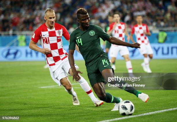 Kelechi Iheanacho of Nigeria runs with the ball under pressure from Domagoj Vida of Croatia during the 2018 FIFA World Cup Russia group D match...